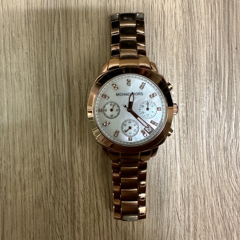 Rose gold Michael Kors Slim Runway watch with mother of pearl